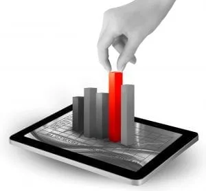 Hand placing a red bar in a chart on a tablet.